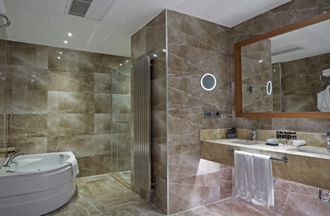 Grand Suite, 1 Bedroom, Jetted Tub, City View | Bathroom | Shower, slippers, towels