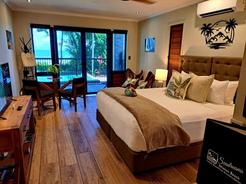 Luxury Suite, Beach View, Ground Floor | Premium bedding, in-room safe, laptop workspace, blackout drapes