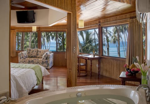 Suite, Ocean View (Tiki Suite) | Down comforters, minibar, in-room safe, desk