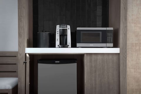 Desk, laptop workspace, blackout drapes, iron/ironing board