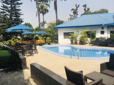 Outdoor pool, pool umbrellas, sun loungers