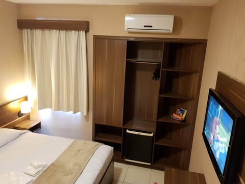 Triple Room, Multiple Beds, City View | Minibar, desk, laptop workspace, blackout drapes