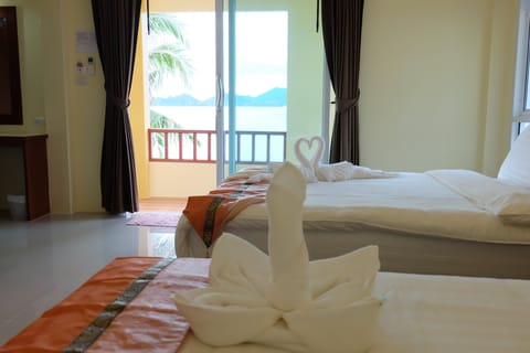 Quadruple Room, Non Smoking, Beachfront | In-room safe, free WiFi, bed sheets