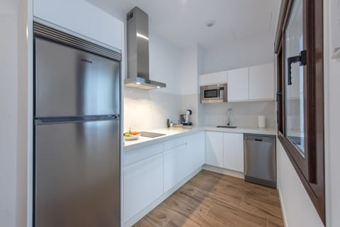 Apartment | Private kitchen | Fridge, microwave, stovetop, dishwasher