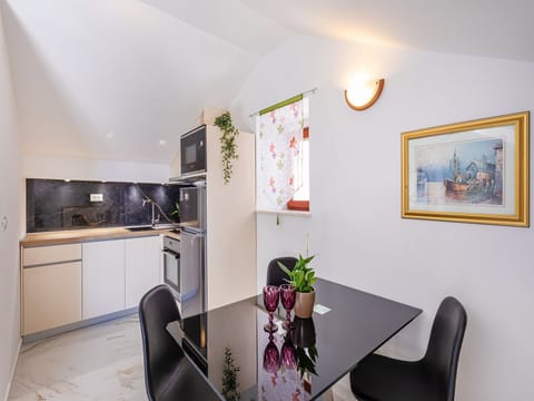 Apartment (One Bedroom Apartment with Balcony an) | Private kitchen | Fridge, dining tables