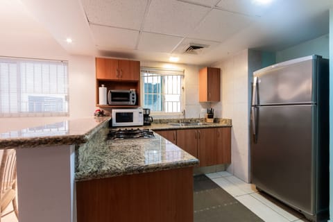 Comfort Apartment | Private kitchen | Full-size fridge, microwave, blender, cookware/dishes/utensils