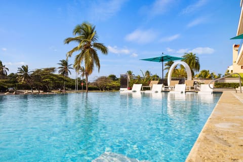 Outdoor pool, pool umbrellas, sun loungers