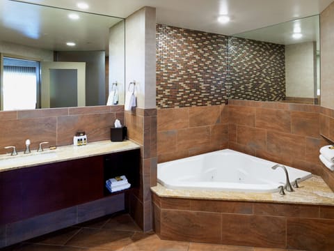 Deluxe Suite, 1 King Bed, Non Smoking, Refrigerator & Microwave (with Sofabed) | Bathroom | Combined shower/tub, free toiletries, hair dryer, towels