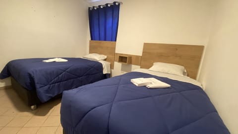 Economy Twin Room, 1 Bedroom | Down comforters, pillowtop beds, free WiFi, bed sheets