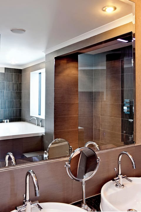 Suite, 1 King Bed, City View (Glasshouse) | Bathroom | Separate tub and shower, designer toiletries, hair dryer, bathrobes