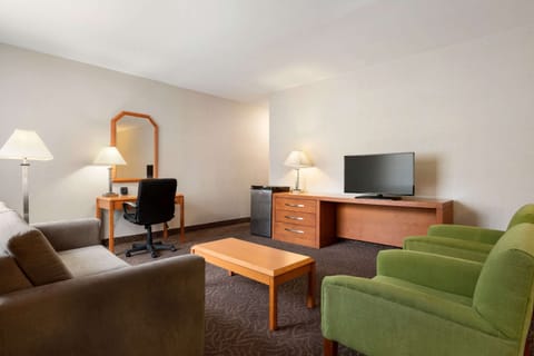 Suite, 1 King Bed, Non Smoking | Desk, laptop workspace, iron/ironing board, free cribs/infant beds