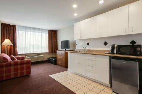 Suite, 2 Queen Beds, Non Smoking | Desk, laptop workspace, iron/ironing board, free cribs/infant beds