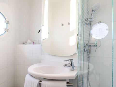 Shower, eco-friendly toiletries, hair dryer, towels