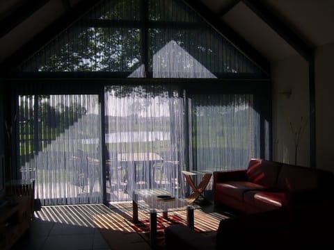 Romantic Cabin | Living area | 100-cm flat-screen TV with satellite channels, TV, DVD player