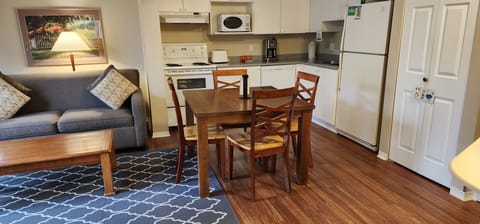 One Bedroom & Den Robson | Private kitchen | Full-size fridge, microwave, oven, stovetop
