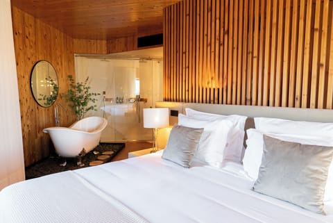 Panoramic Suite | Bathroom | Designer toiletries, hair dryer, bathrobes, slippers