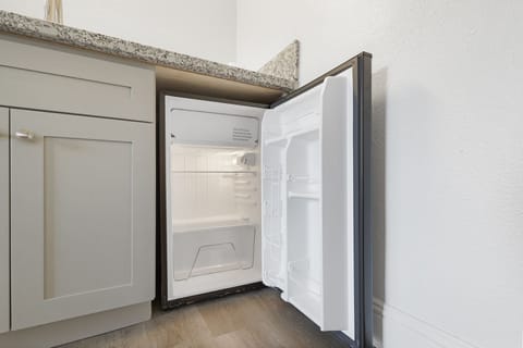 Suite, 1 King Bed | Desk, blackout drapes, iron/ironing board, free WiFi