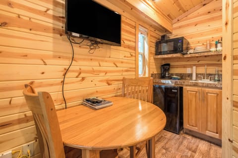 Deluxe Cabin (No Pets, Linens Included) | Private kitchen | Coffee/tea maker, dining tables