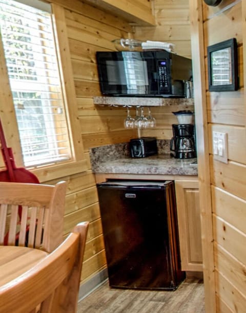 Fridge, microwave, coffee/tea maker, cookware/dishes/utensils