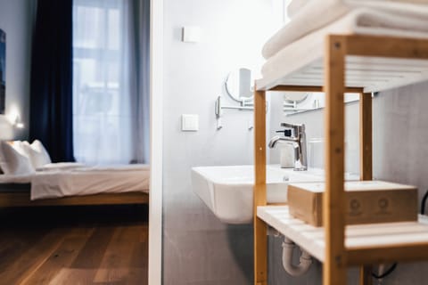 Deluxe Room, 1 King Bed | Bathroom | Shower, hair dryer, towels, soap