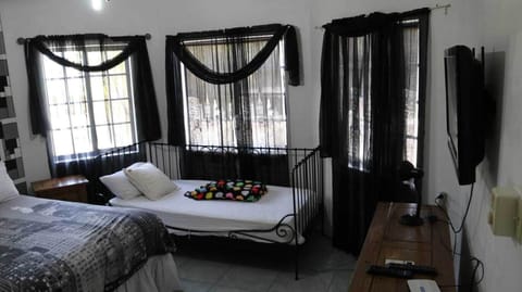 Deluxe Room, 1 Bedroom | In-room safe, laptop workspace, blackout drapes, iron/ironing board