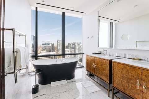 District Suite | Bathroom | Designer toiletries, hair dryer, bathrobes, slippers