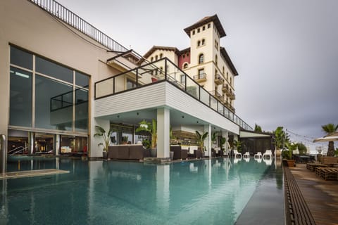 Indoor pool, outdoor pool, pool umbrellas