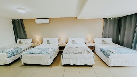 Family Quadruple Room, 1 Bedroom | Premium bedding, individually furnished, desk, laptop workspace