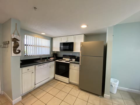 Partial Gulf View Condo 309 | Private kitchen | Full-size fridge, microwave, oven, stovetop