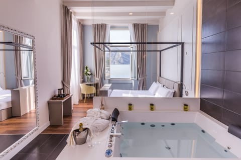 Junior Suite, Hot Tub, Lake View | Jetted tub