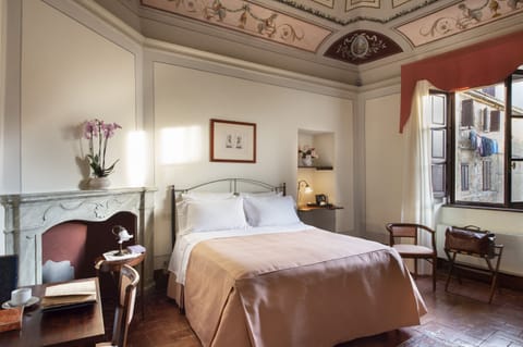 Superior Room | Minibar, in-room safe, desk, iron/ironing board