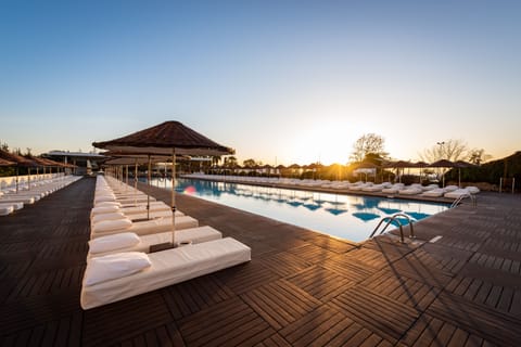 Indoor pool, seasonal outdoor pool, pool umbrellas, sun loungers