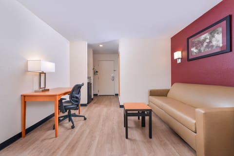 Suite, 1 King Bed (Smoke Free) | Desk, laptop workspace, blackout drapes, iron/ironing board