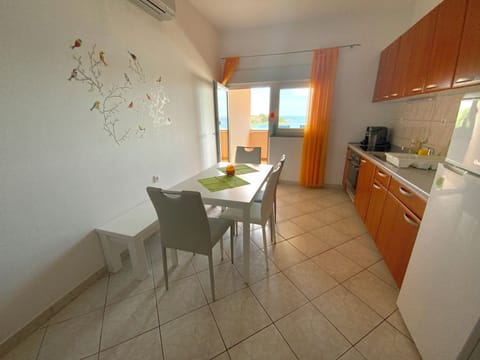 Apartment, Balcony, Ocean View (8) | Private kitchen | Full-size fridge, stovetop, cookware/dishes/utensils, cleaning supplies