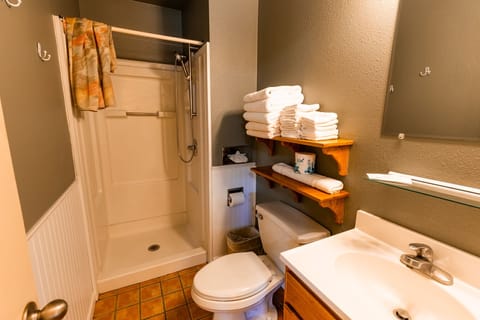 Economy Studio, 2 Double Beds | Bathroom | Rainfall showerhead, hair dryer, towels, soap