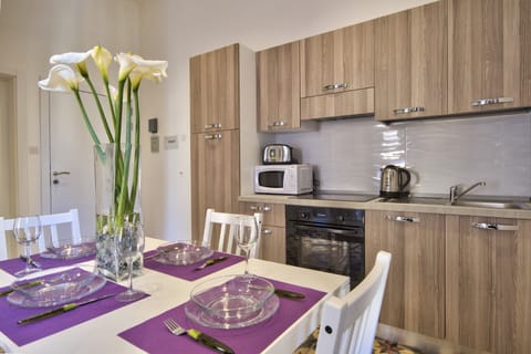 Comfort Apartment | Private kitchen | Full-size fridge, microwave, oven, stovetop