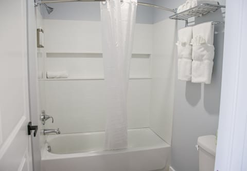 Combined shower/tub, hair dryer, towels, soap