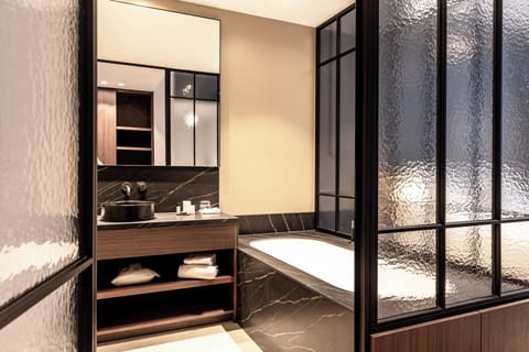 The Roomy | Bathroom | Shower, rainfall showerhead, hair dryer, towels