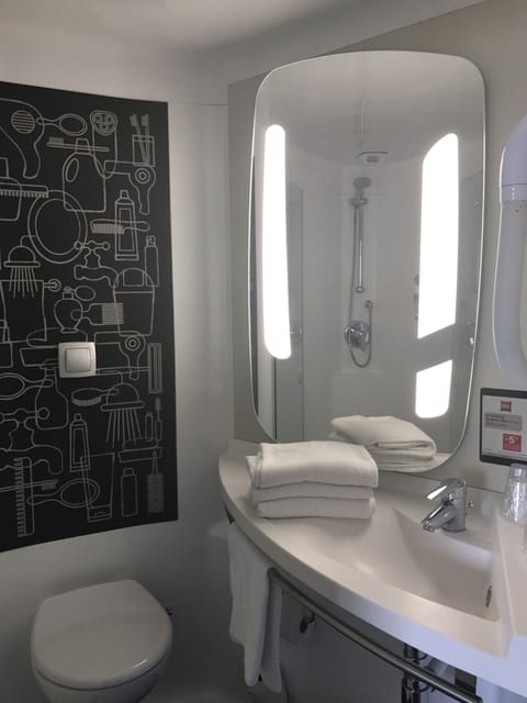 Shower, eco-friendly toiletries, hair dryer, towels