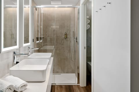 Premium bedding, down comforters, pillowtop beds, minibar