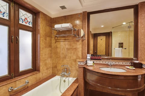 Separate tub and shower, designer toiletries, hair dryer, bathrobes