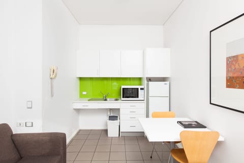 Executive One Bedroom Apartment | Private kitchen | Full-size fridge, microwave, electric kettle, cookware/dishes/utensils