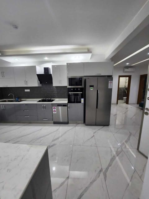 Apartment | Private kitchen | Full-size fridge, microwave, oven, stovetop