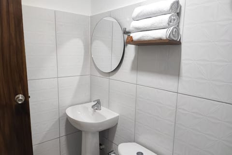 Standard Quadruple Room | Bathroom | Shower, rainfall showerhead, towels, soap