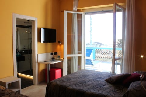 Triple Room, Sea View | Minibar, in-room safe, desk, soundproofing