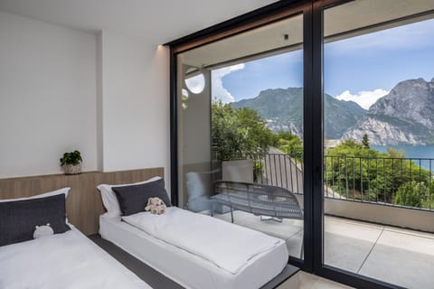 Junior Studio Suite, Terrace, Partial Lake View | Minibar, in-room safe, desk, laptop workspace