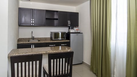 Suite, 1 King Bed | Down comforters, in-room safe, desk, blackout drapes