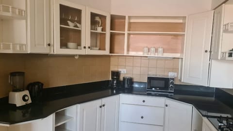 Apartment, 2 Bedrooms | Private kitchenette | Fridge, stovetop, electric kettle, cookware/dishes/utensils