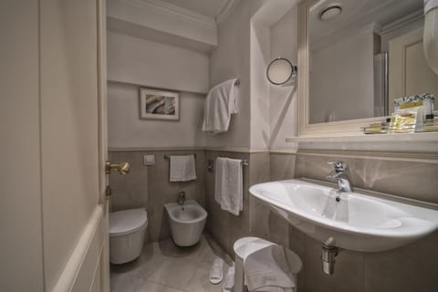 Combined shower/tub, eco-friendly toiletries, hair dryer, slippers