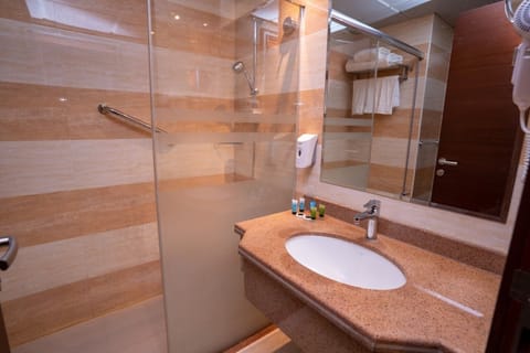 Family Triple Room | Bathroom | Separate tub and shower, hydromassage showerhead, hair dryer, slippers